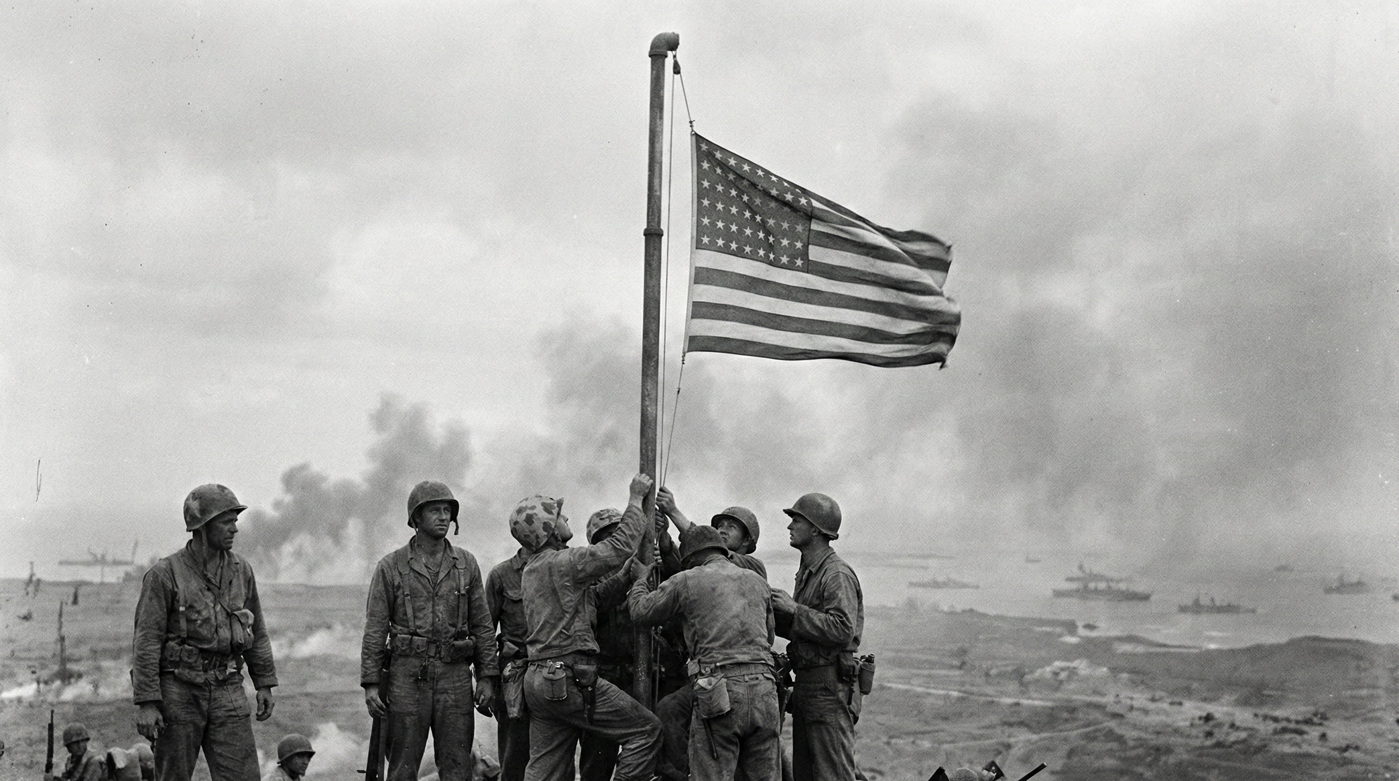 On This Day: 1945 - During the Battle of Iwo Jima, a group of United States Marines reach the top of Mount Suribach